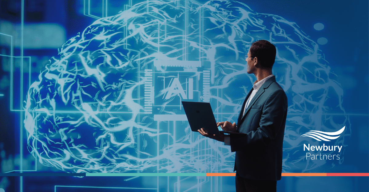 A man in a suit holds a laptop in front of a brain, symbolizing technology and artificial intelligence.
