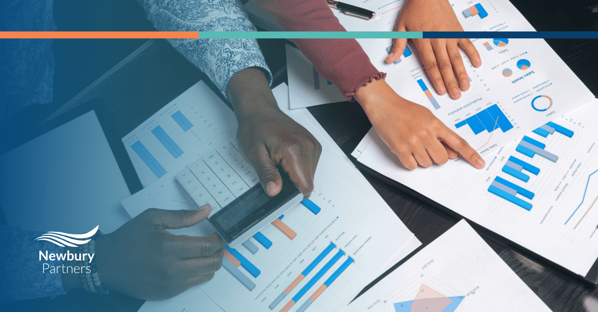 a staffing commission management team reviewing automated commission calculation reports and payout transparency charts