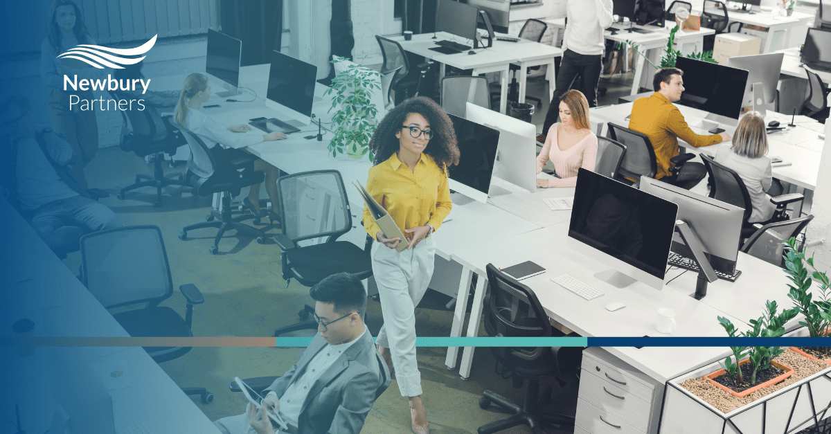 Business professionals in modern conference room discussing custom Bullhorn integration solutions for staffing firm automation and workflow optimization.