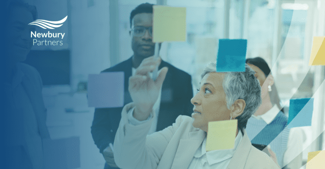 A group of people in an office demonstrating how Kanban transforms staffing operations.