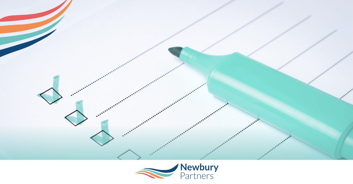 Checklist with pen representing staffing tech compliance requirements and 2026 regulatory preparation.