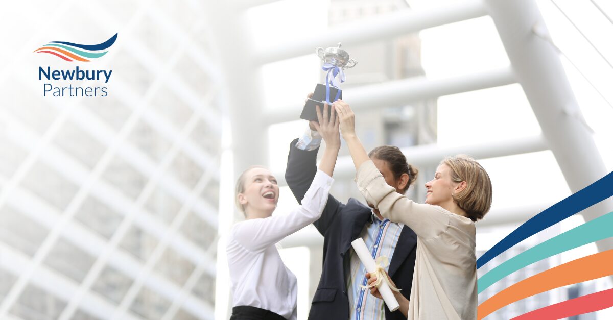 Team celebrating staffing workflow automation success and implementation wins in modern office setting.