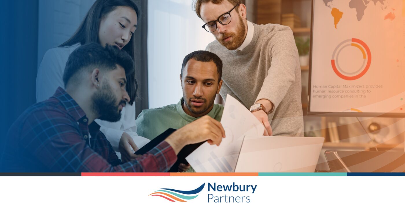 Staffing team reviewing reports and data together to ensure commissions accuracy before technology implementation.Staffing team reviewing reports and data together to ensure commissions accuracy before technology implementation.