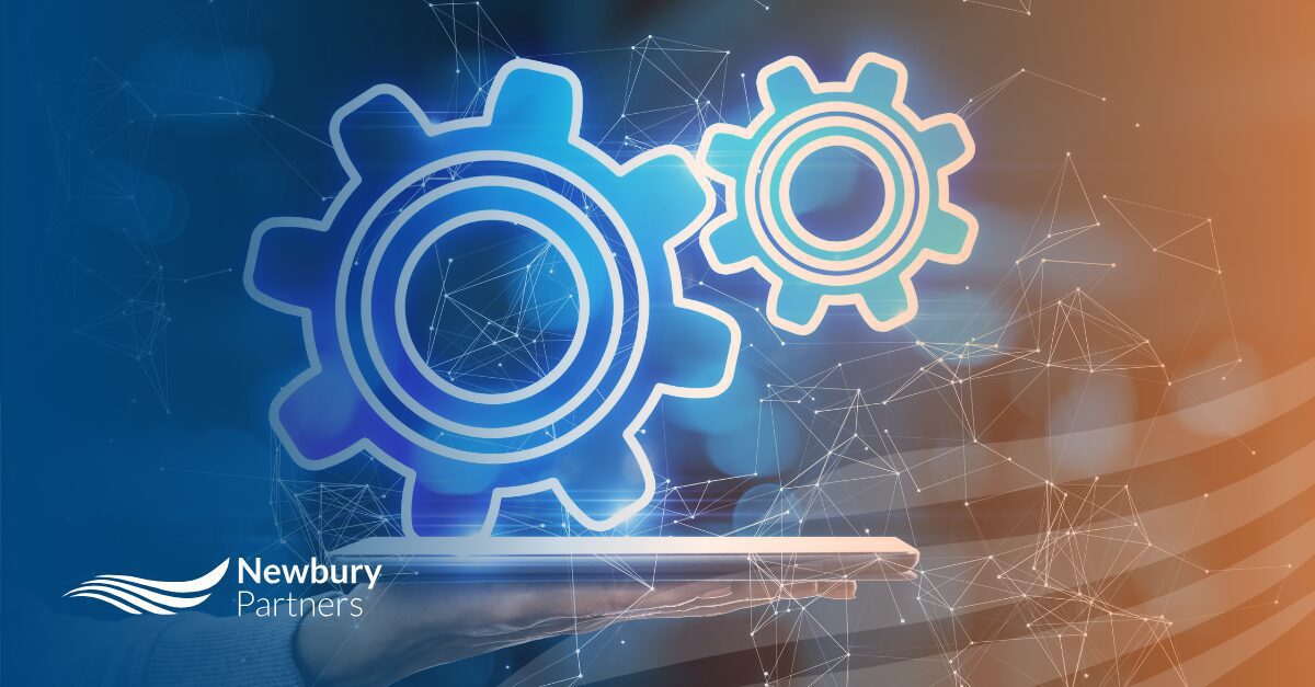 Interconnected gears on a digital network background illustrating the automated systems that depend on data quality in staffing technology.Interconnected gears on a digital network background illustrating the automated systems that depend on data quality in staffing technology.