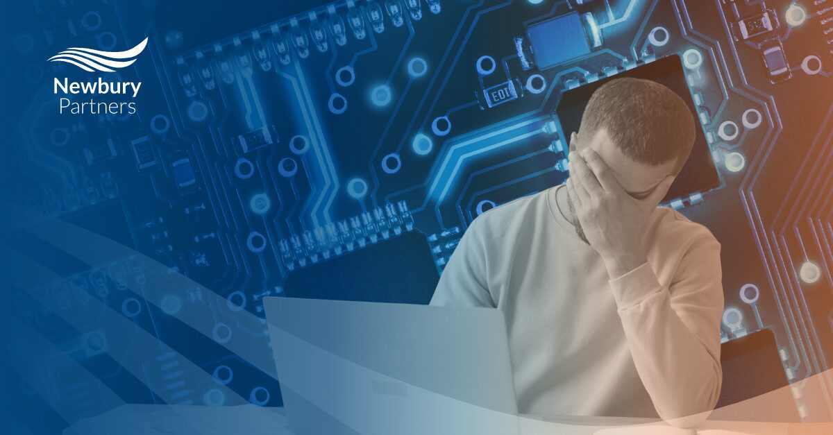 Frustrated staffing professional at laptop overwhelmed by recruiter tech overload and system complexity.