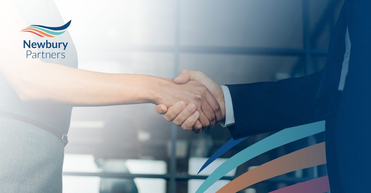 Staffing firm consultant and client handshake representing a modular commission system partnership.